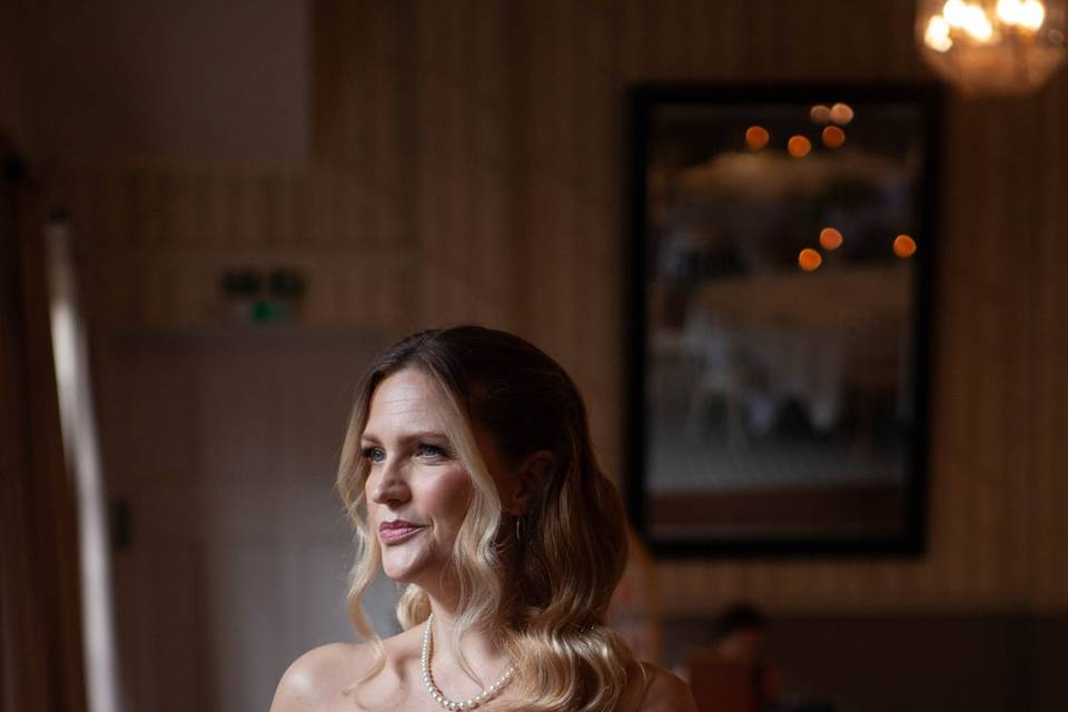 A softly lit bridal portrait indoors